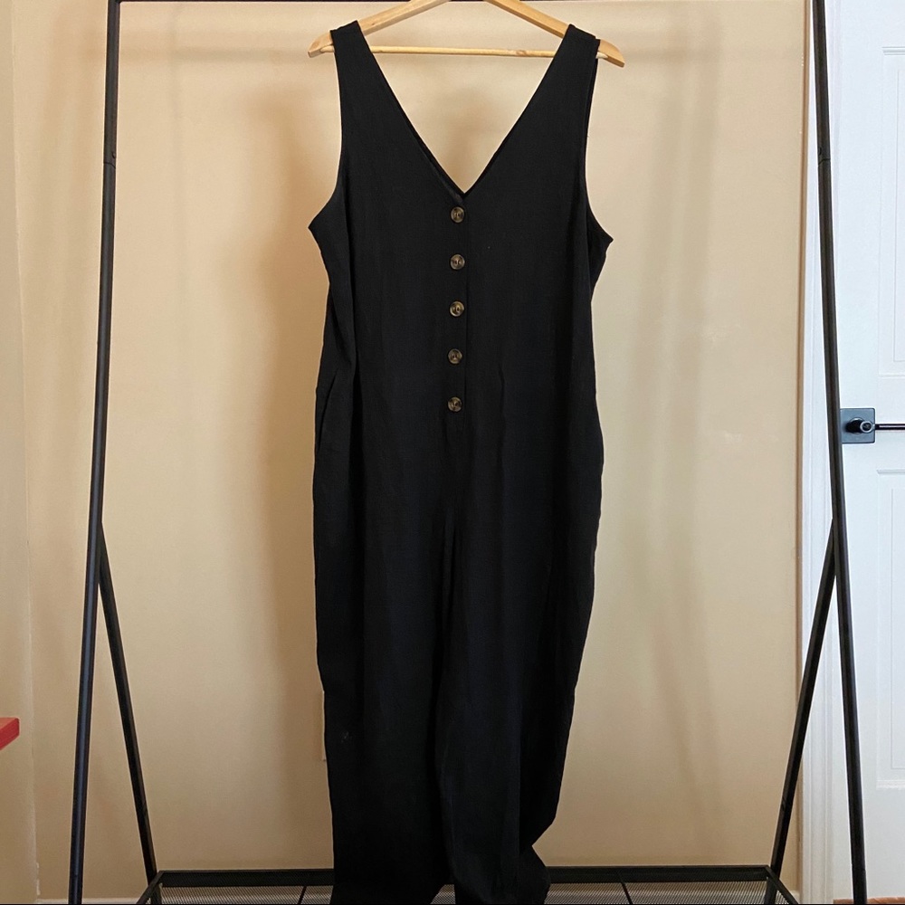 Black jumpsuit with buttons and pockets. Size XL